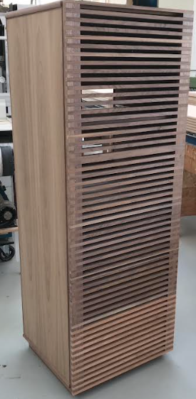All walnut 50"H stereo cabinet with slat door. Bottom door section in cherry.